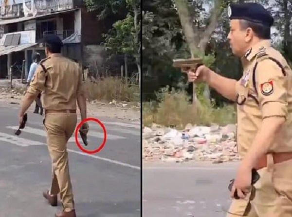 उपद्रवियों को खदेड़ते पुलिस अधिकारी उपद्रवियों को खदेड़ते पुलिस अधिकारी