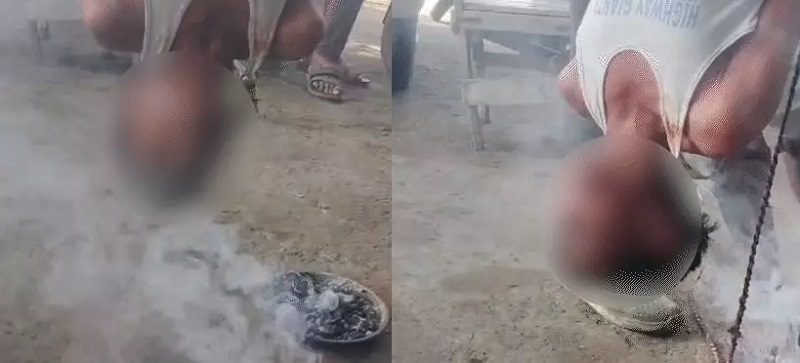 उल्टा लटका हुआ बच्चा, मिर्च की धुनी देते हुए उल्टा लटका हुआ बच्चा, मिर्च की धुनी देते हुए