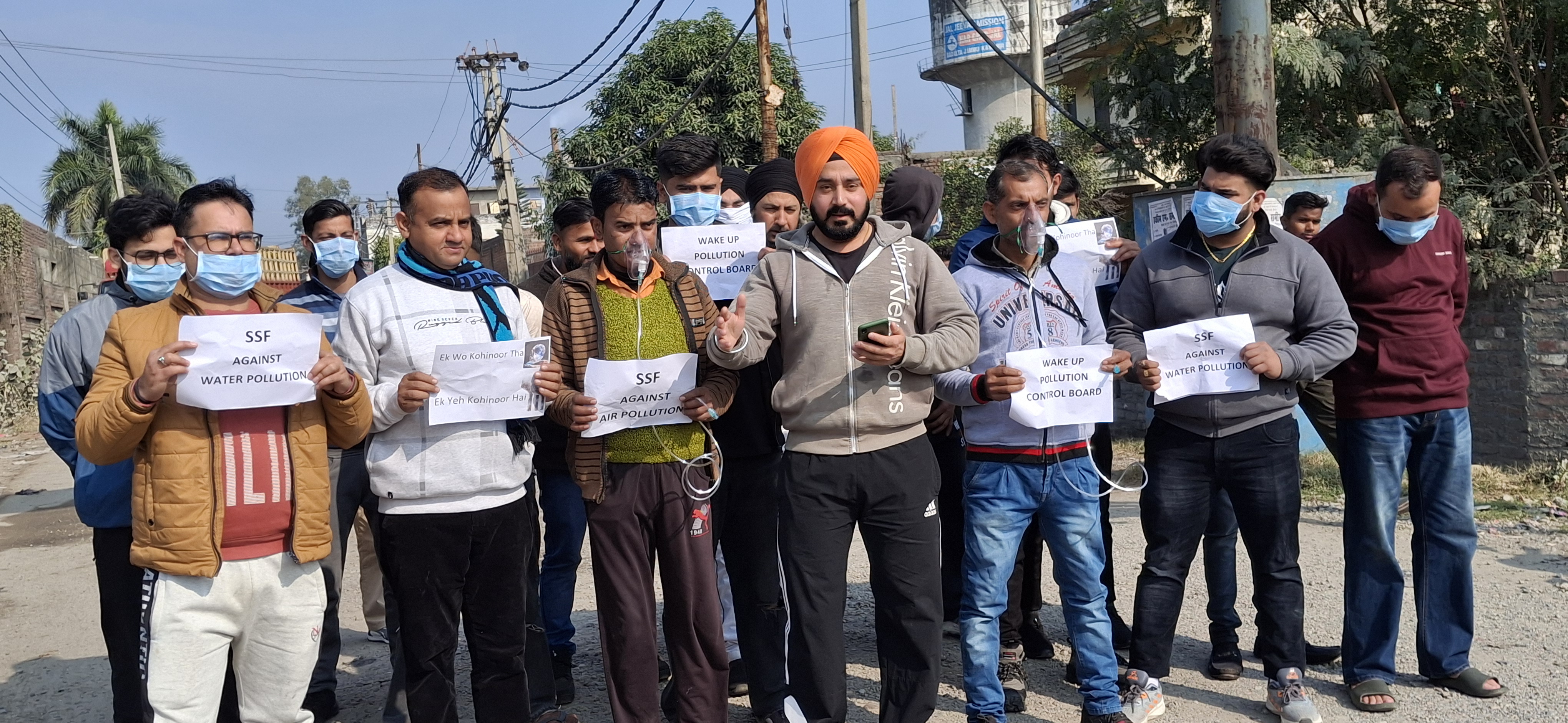 SSF protested against the pollution control department by wearing oxygen masks on their mouths SSF protested against the pollution control department by wearing oxygen masks on their mouths