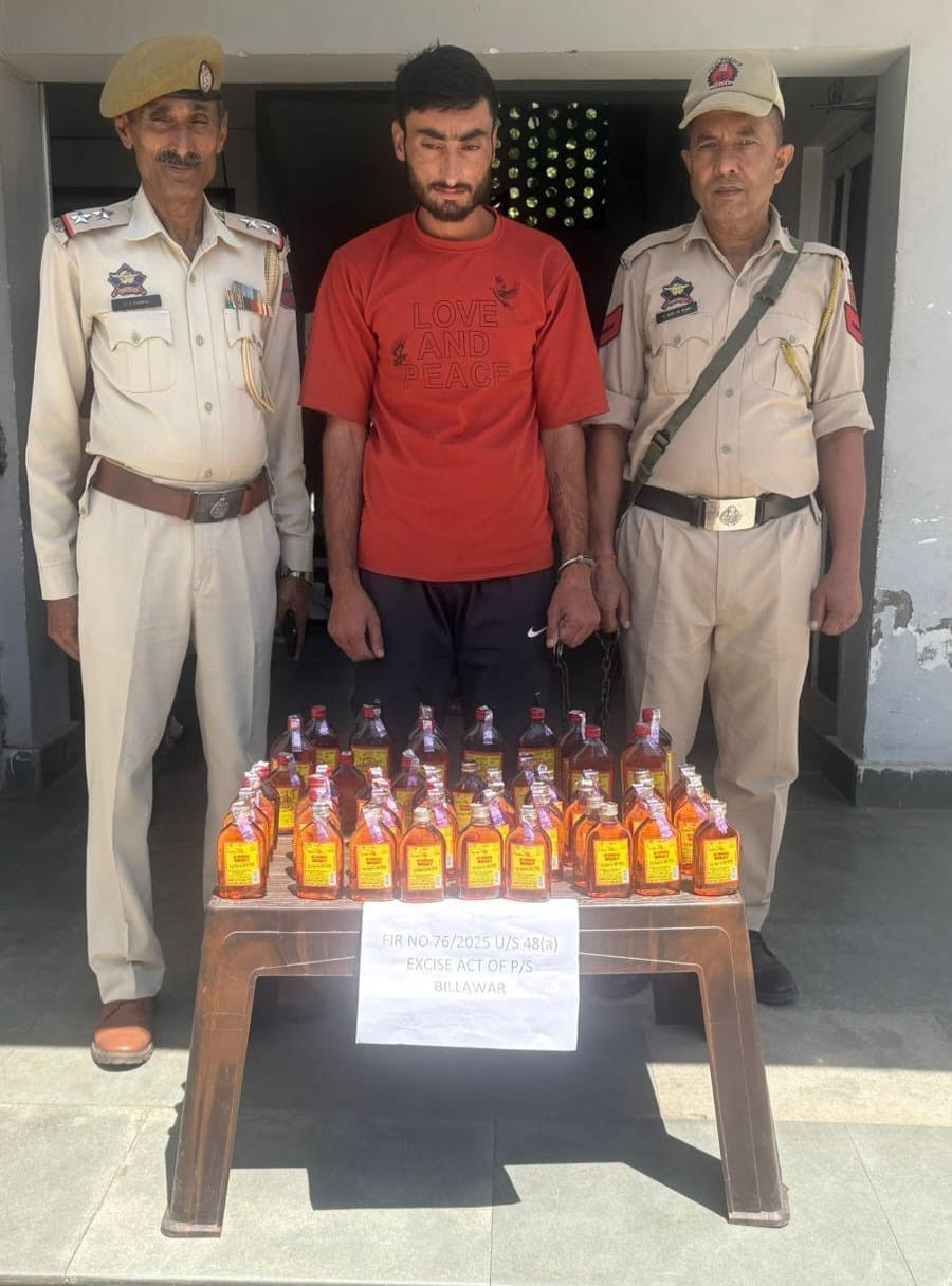 A smuggler arrested with illegal liquor A smuggler arrested with illegal liquor
