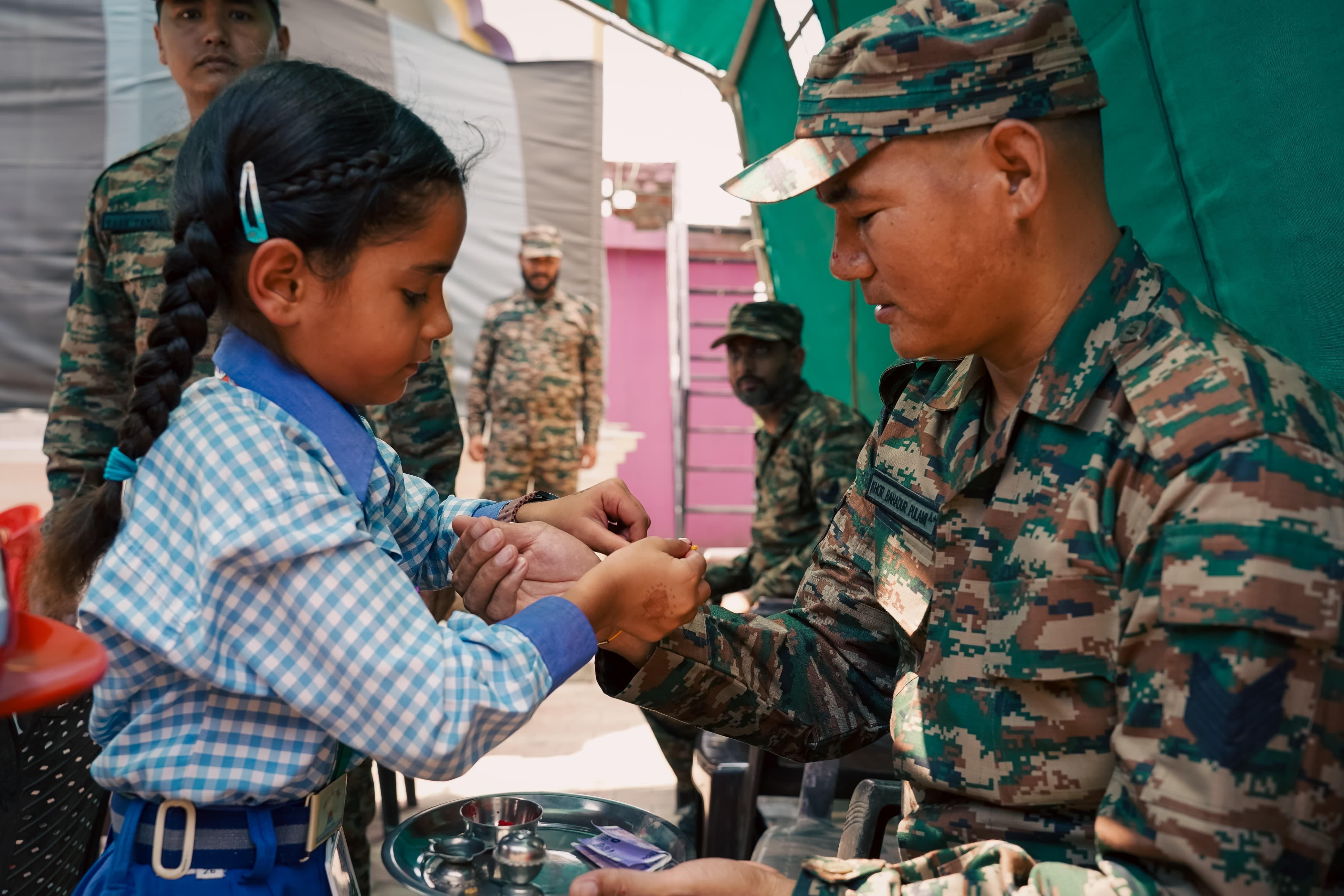 Children tied colourful rakhis on the wrists of soldiers