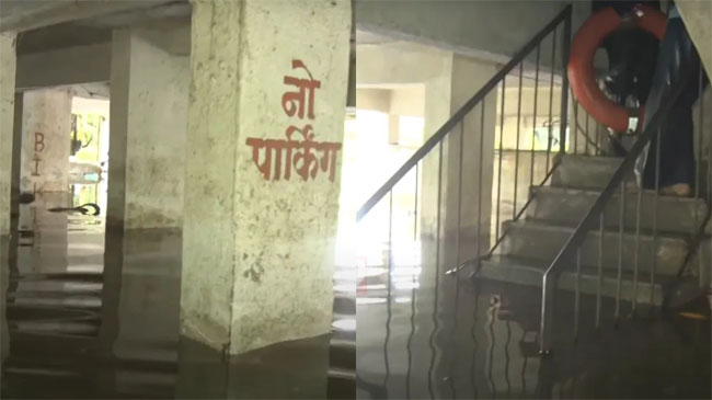 फोटो:पुणे में भारी बारिश से आई बाढ़ में फंसे लोगों को बचाने का काम जारी फोटो:पुणे में भारी बारिश से आई बाढ़ में फंसे लोगों को बचाने का काम जारी