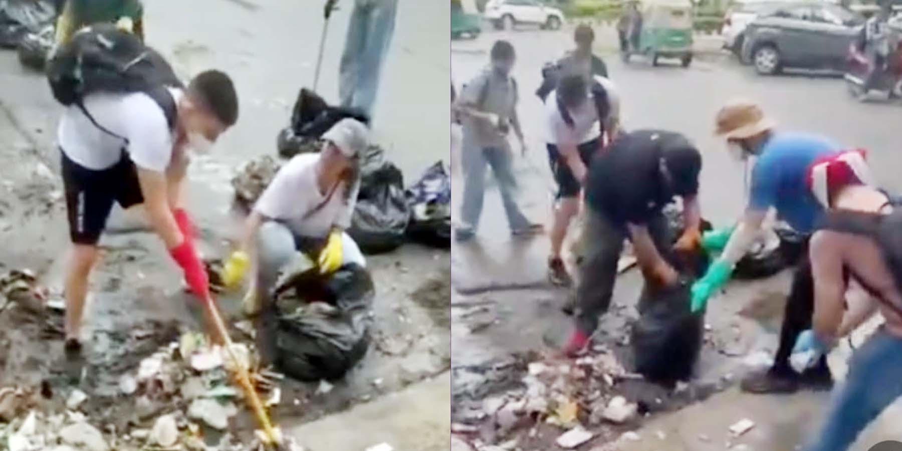गुरुग्राम में द्रोणाचार्य मेट्रो स्टेशन के आसपास गंदगी साफ करते विदेशी नागरिक। गुरुग्राम में द्रोणाचार्य मेट्रो स्टेशन के आसपास गंदगी साफ करते विदेशी नागरिक।
