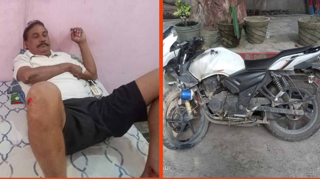 घायल इंस्पेक्टर व क्षतिग्रस्त मोटरसाइकिल घायल इंस्पेक्टर व क्षतिग्रस्त मोटरसाइकिल