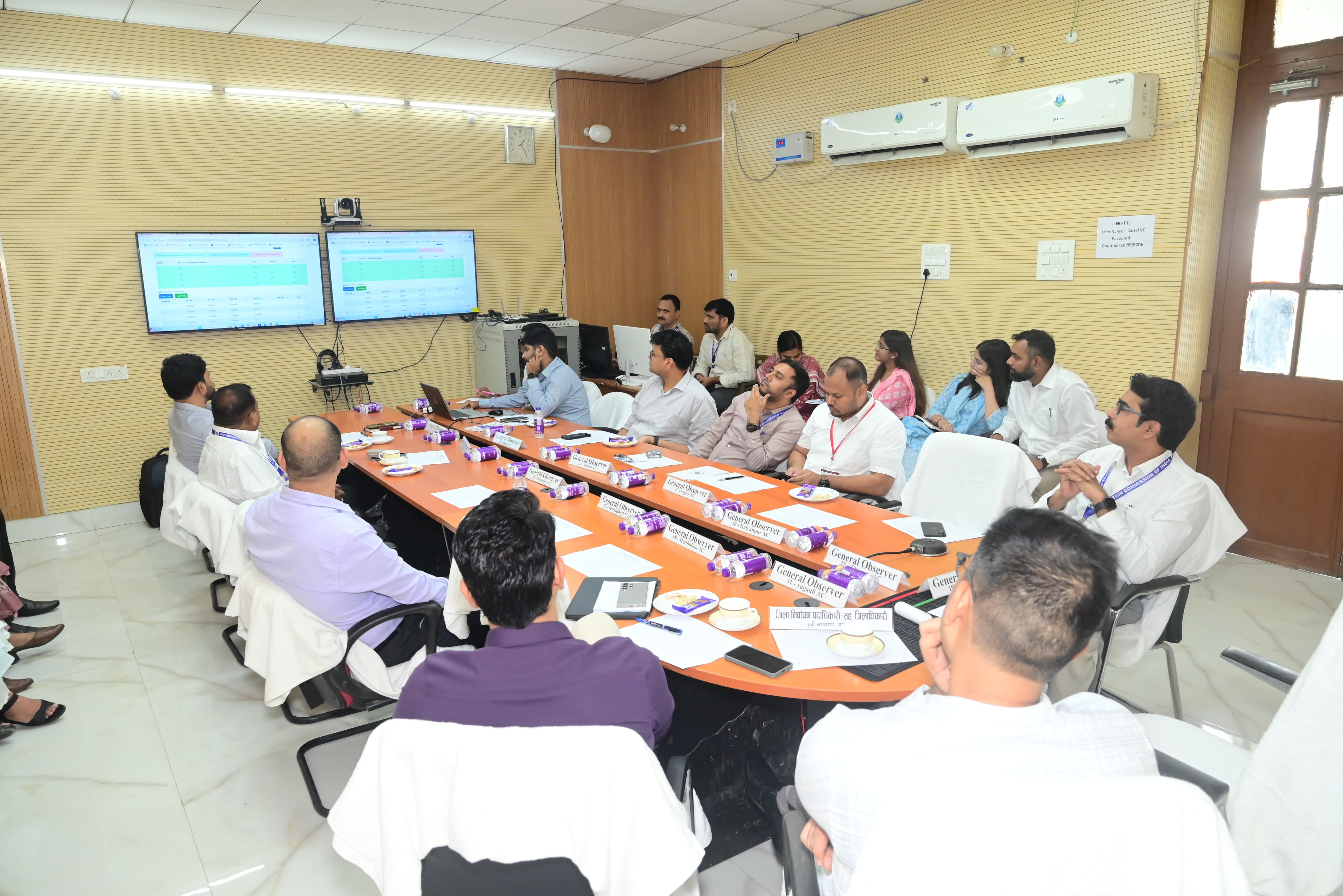 Officials meeting with observers