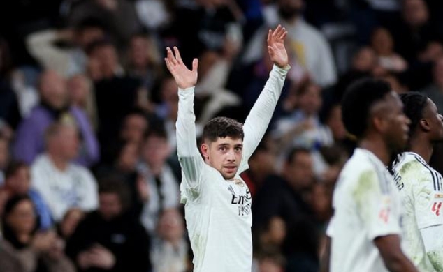 Federico Valverde celebrating happily after scoring a goal. Federico Valverde celebrating happily after scoring a goal.