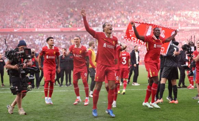Liverpool players celebrating after their title victory.