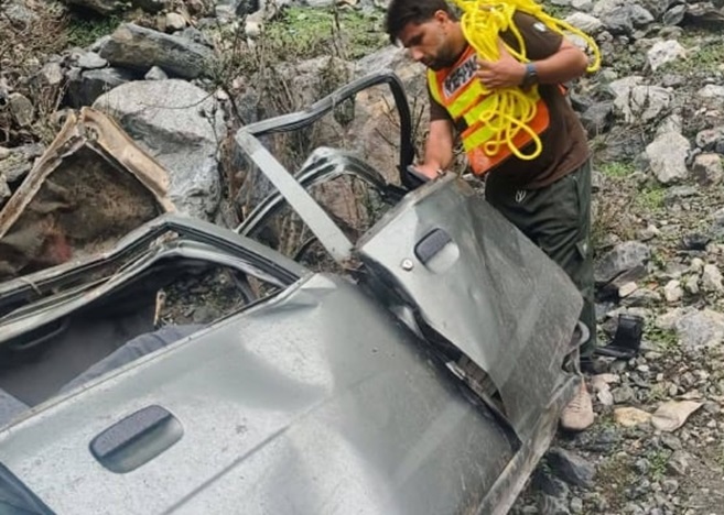 The car that overturned and fell into the ditch on the Karakoram Highway adjacent to the Indus River. The car that overturned and fell into the ditch on the Karakoram Highway adjacent to the Indus River.
