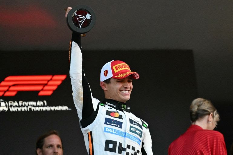 Lando Norris lifts the trophy Lando Norris lifts the trophy
