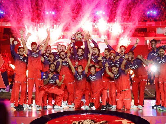 RCB team with the IPL trophy. RCB team with the IPL trophy.