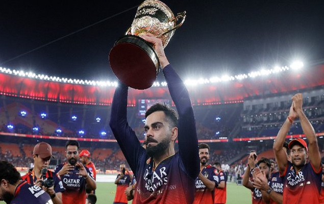 RCB team with the IPL trophy. RCB team with the IPL trophy.