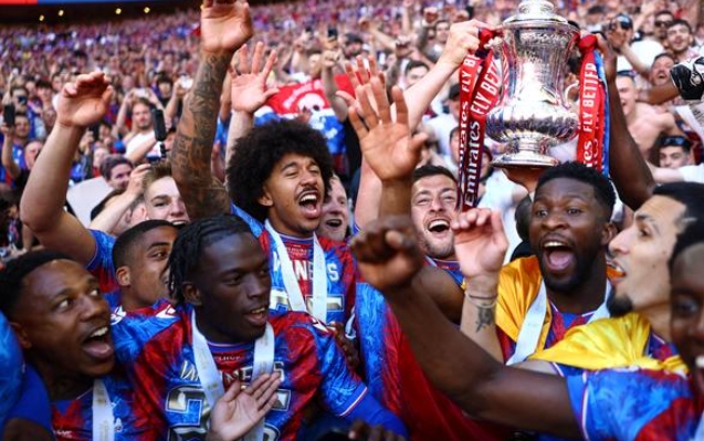 Crystal Palace's Joel Ward celebrating with the team after winning the FA Cup.